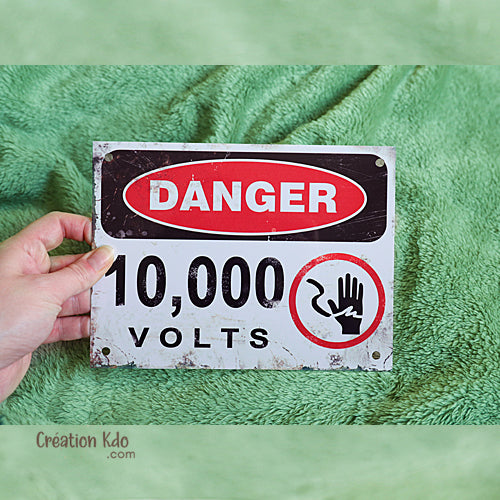 panneau 10000 volts plaque danger dinosaure jurassic park tyrannosaure